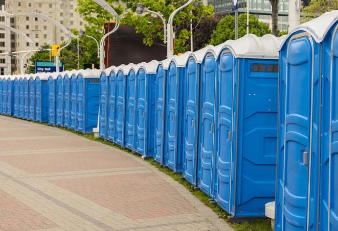 a row of portable restrooms at a fairground, offering visitors a clean and hassle-free experience in Crozet